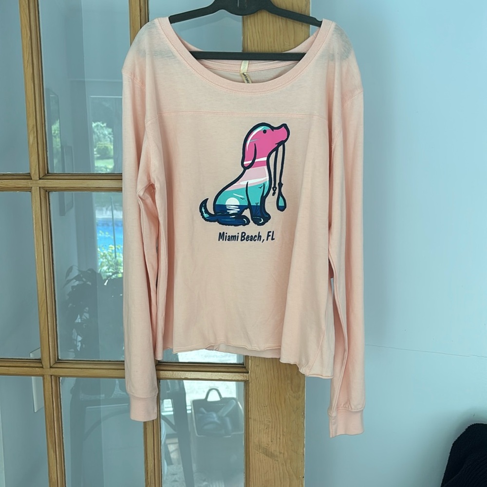 Brand new long sleeved top size medium peach color